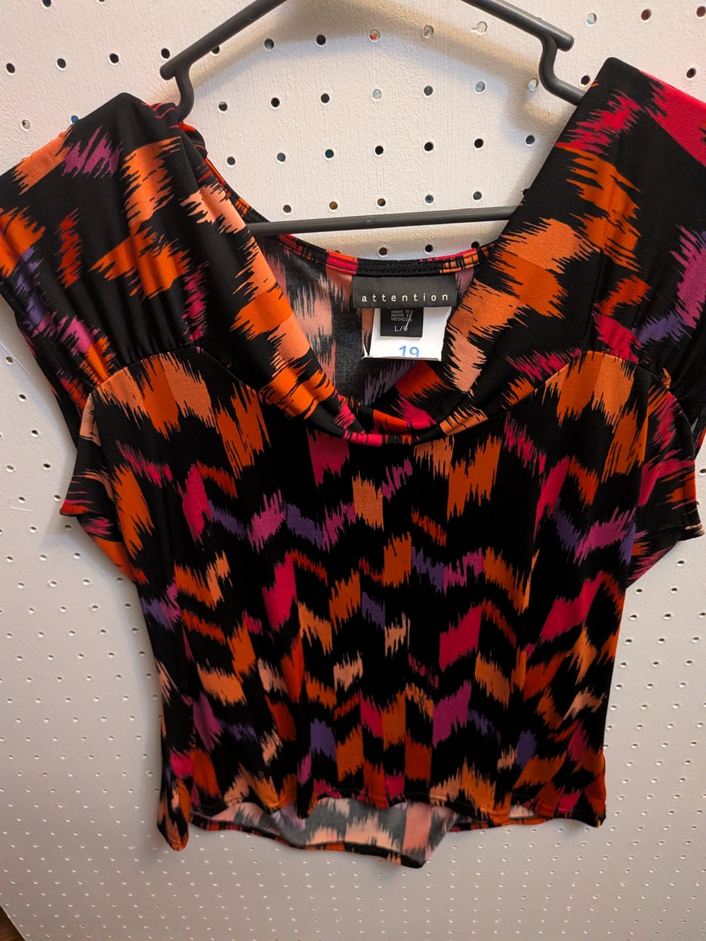 attention Black Short Sleeve Top with Orange, Pink & Purple Abstract Print